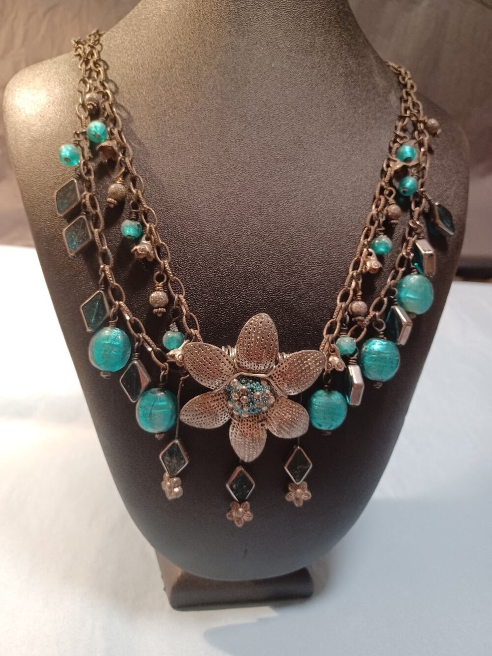 Textured Metal Chain Teal/Turquoise Glass Beads with a wired Flower Focal